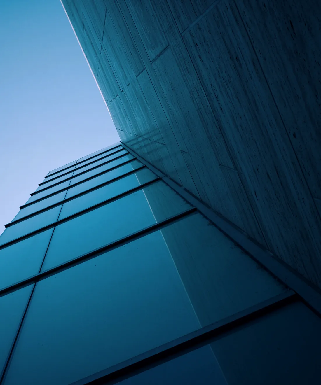 Upward view of a glass office tower
